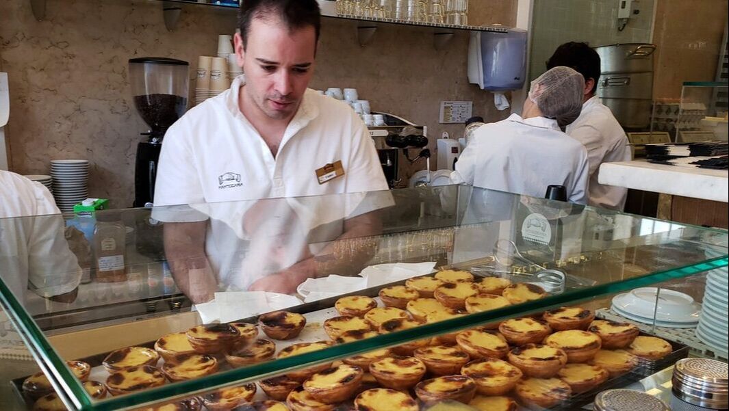 Worker in pastry shop in Lisbon, Portugal