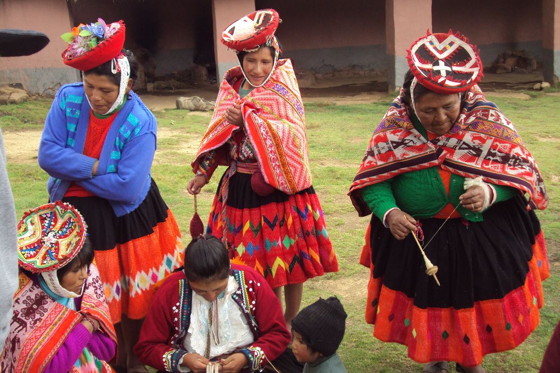 Three native women in colorful clothes in Peru